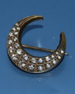 Pretty little rhinestone crescent moon brooch